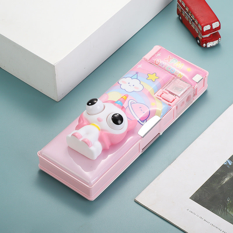 Pink unicorn pencil box with rainbow design and built-in sharpener