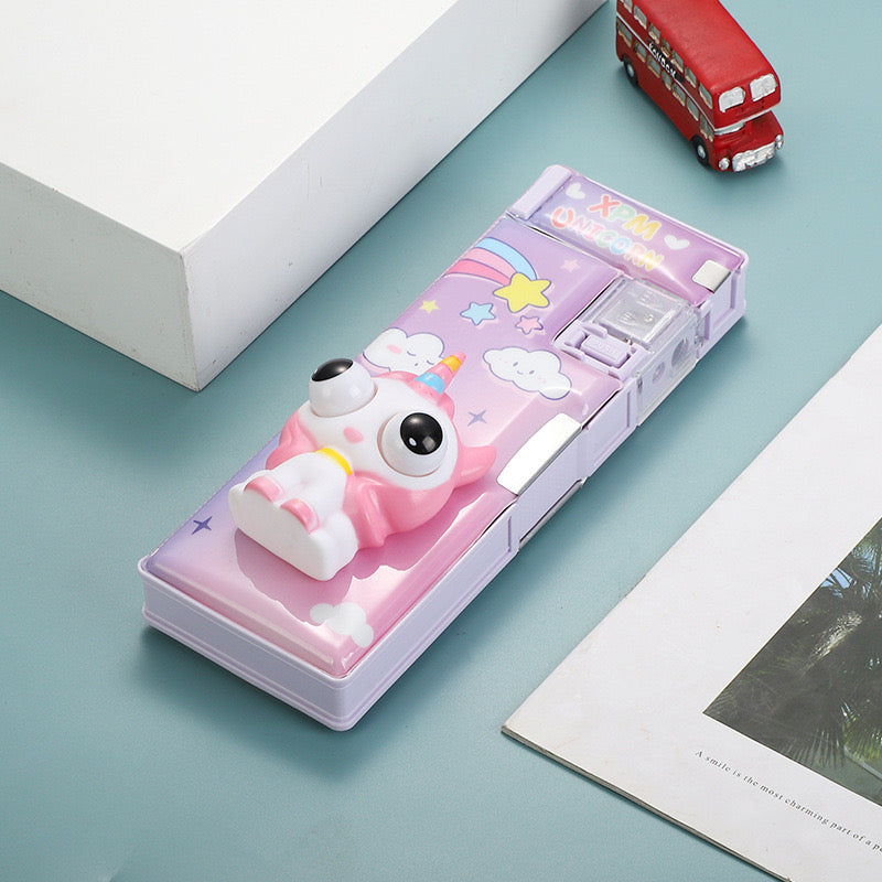 Purple unicorn pencil box with rainbow design and built-in sharpener
