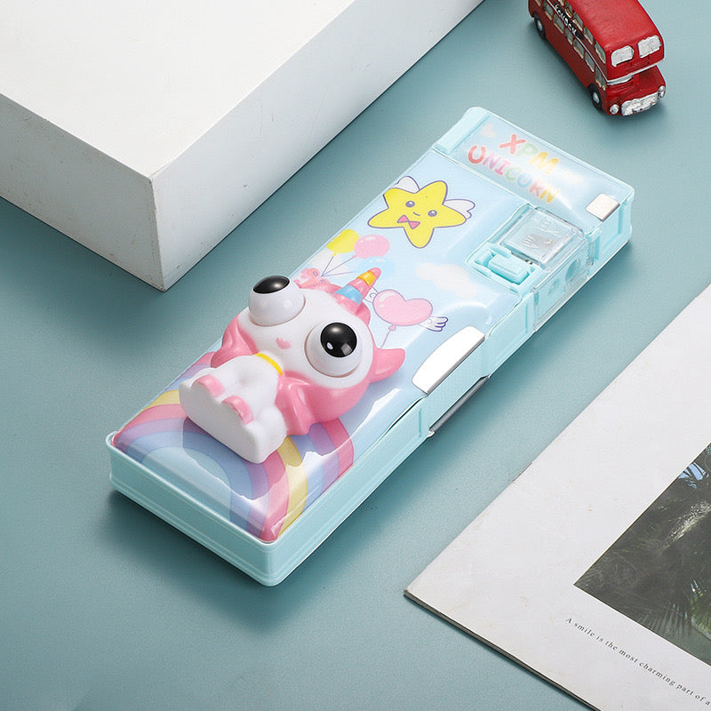 Pastel blue unicorn pencil box with rainbow design and built-in sharpener