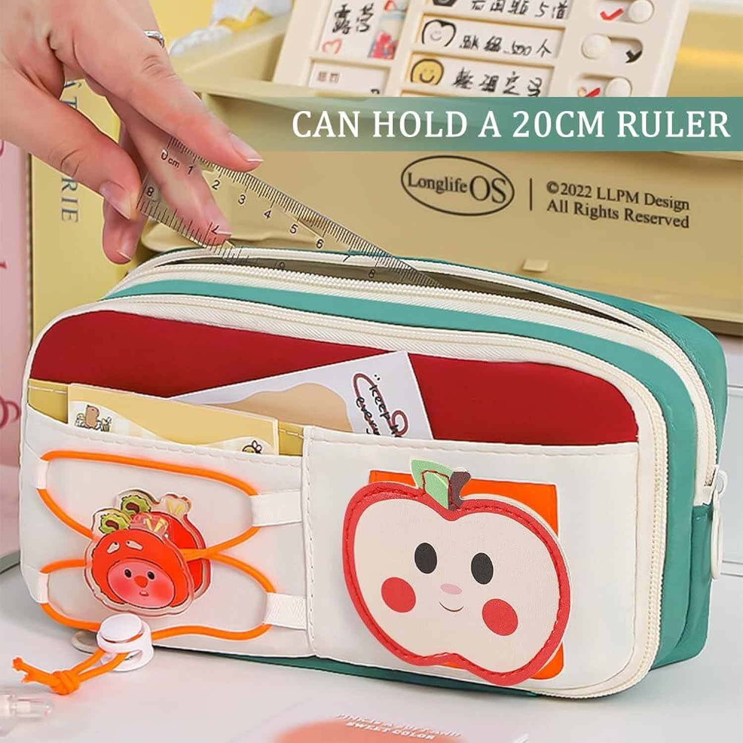 Apple design pencil pouch demonstrating it can hold a 20cm ruler perfect for school kids