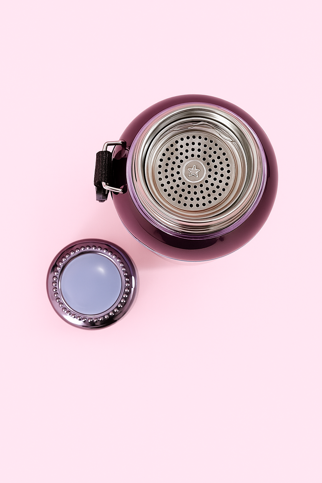 Top view of Hello Kitty thermos with open lid and built-in strainer