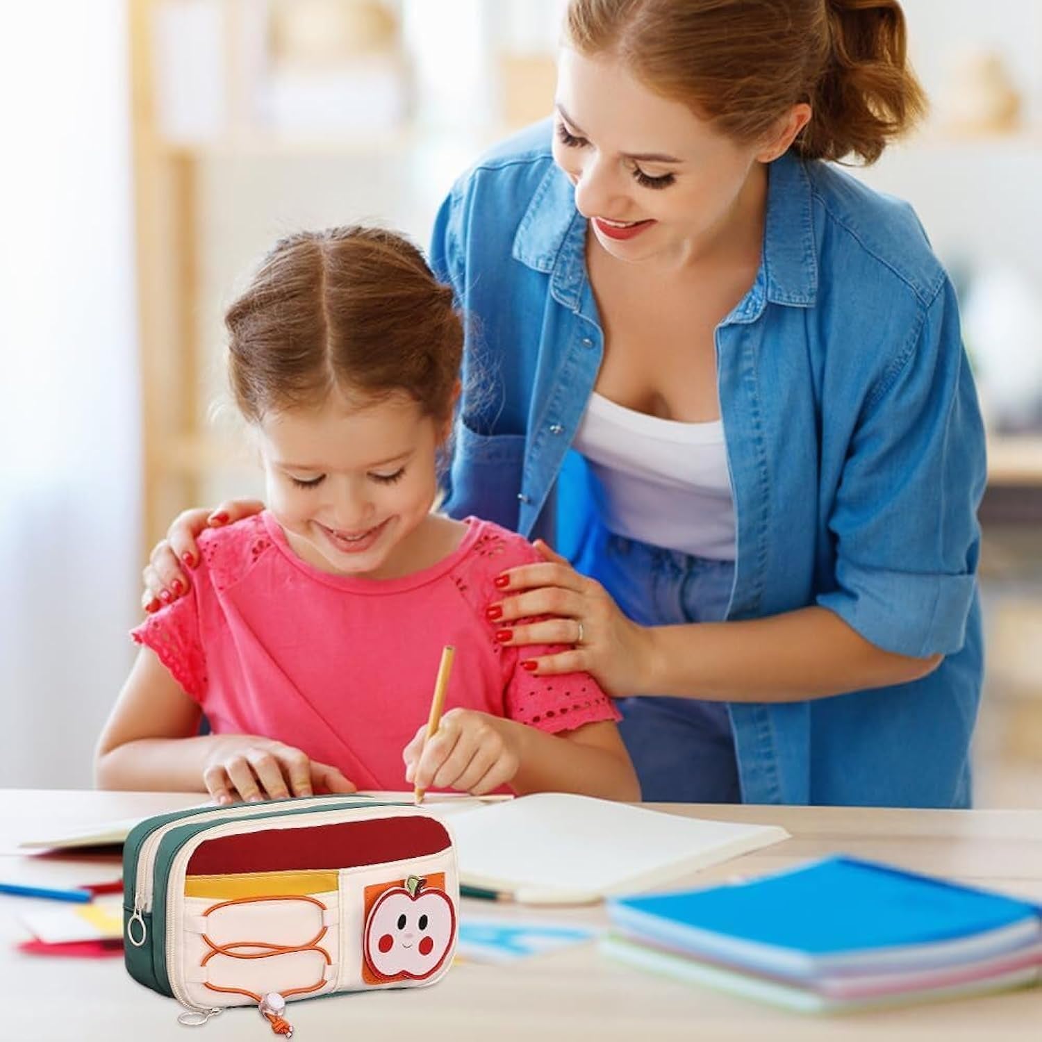 Girl using large capacity apple pencil pouch while studying at home with mother