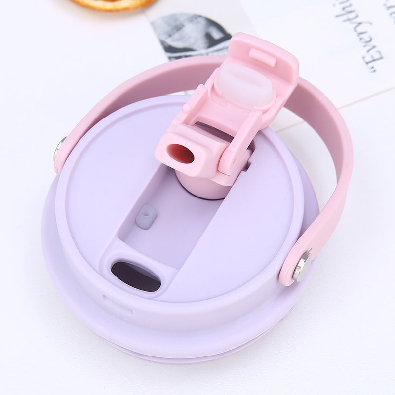 Flip-top straw lid close-up — leak-proof push-button lock on lavender tumbler