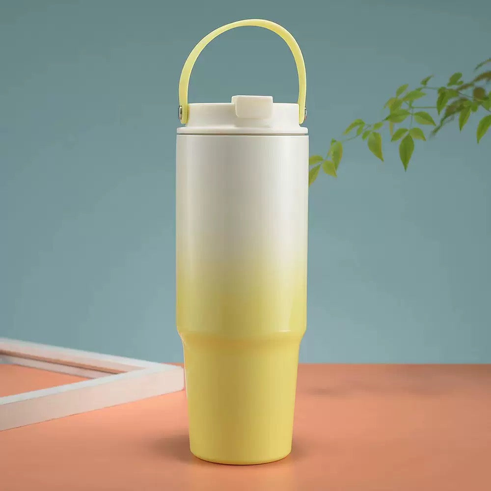 White to yellow ombre 900ml tumbler with silicone handle on table — kids water bottle kidspitara