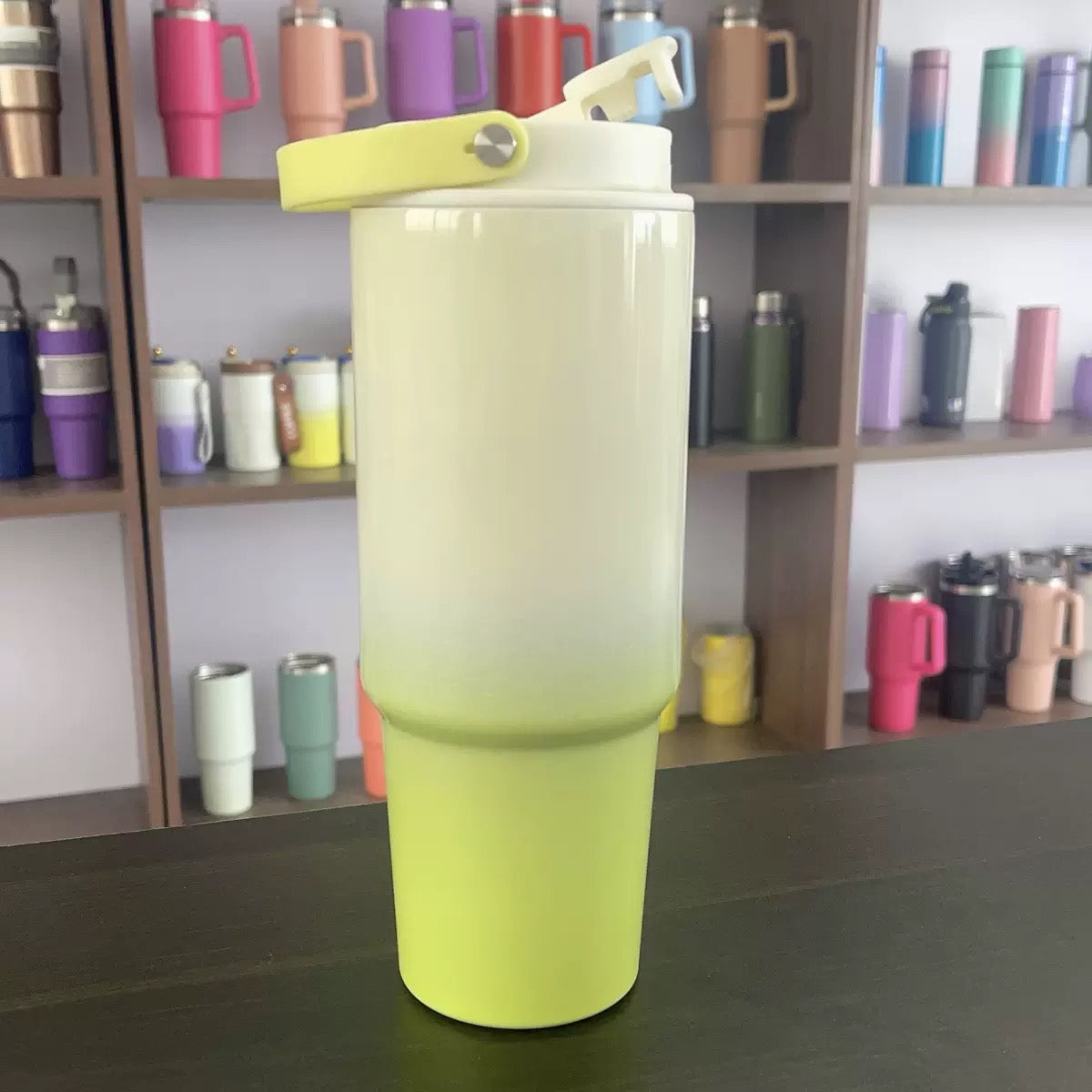Yellow gradient insulated tumbler front view with flip lid and carry handle — buy online India